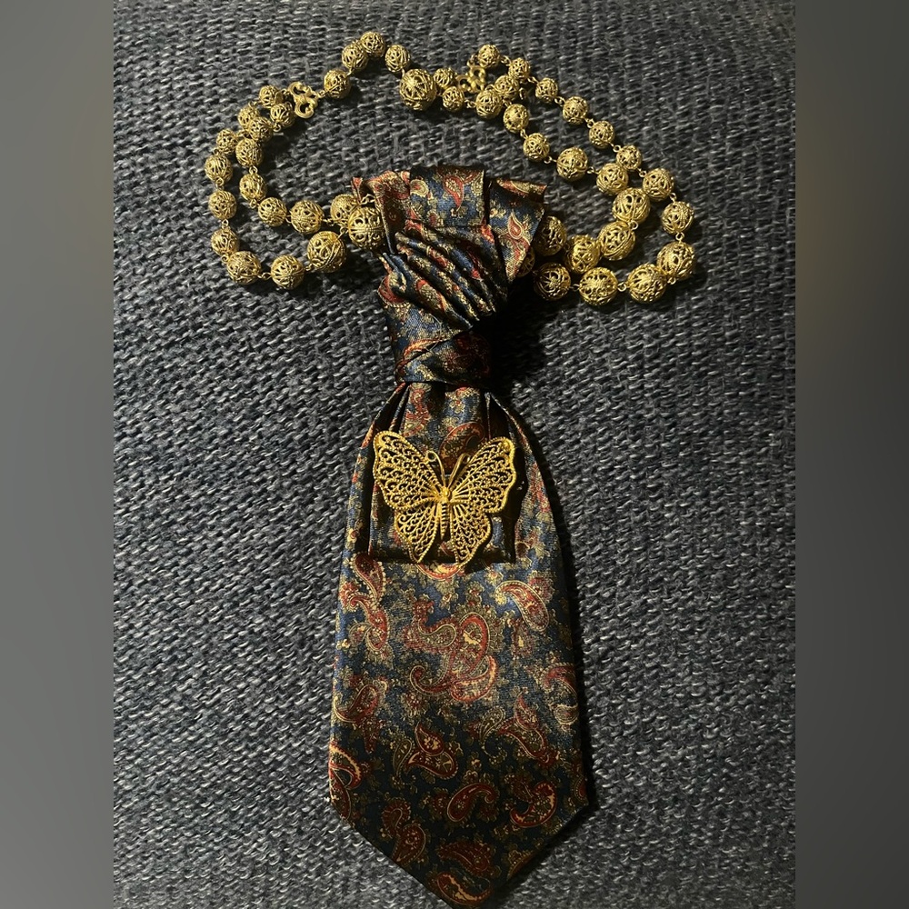 Gold Butterfly Tie Pin on Paisley Navy Tie